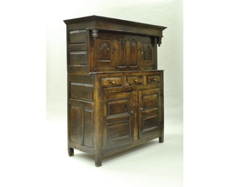 A 19th Century Lancashire oak court cupboard or duodarn (probably Lake District), the moulded cornice above a plain frieze an