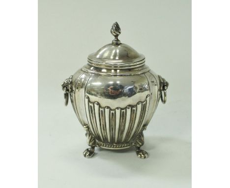 A silver tea caddy in the Classical style with lion mask ring handles (marks rubbed), 6.42 oz