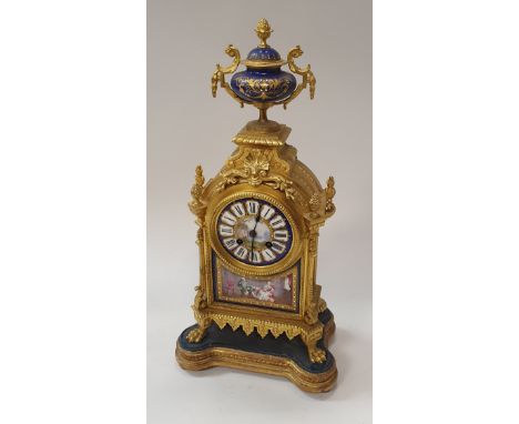 A 19th Century gilt brass cased mantel clock the eight day movement by Japy Freres of Paris the circular painted porcelain di