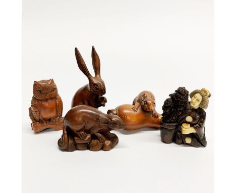 A group of five carved fruitwood netsuke, tallest 7cm.