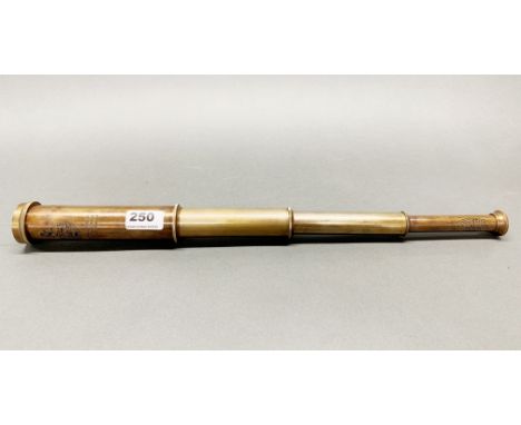 A reproduction brass telescope.
