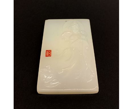 A Chinese white jade / hardstone signed amulet of the goddess Guanyin, size 6 x 4 x 1cm.