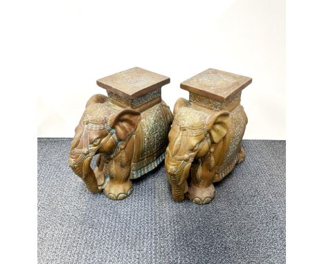A pair of Chinese ceramic elephant garden stools, H. 41cm.