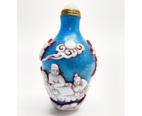 A Chinese three layer carved Peking cameo glass with gilt and white jade stopper, H. 8.5cm. Prov Jean Rich collection.