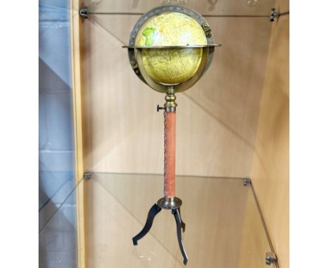 A miniature globe on stand, H. 38cm.