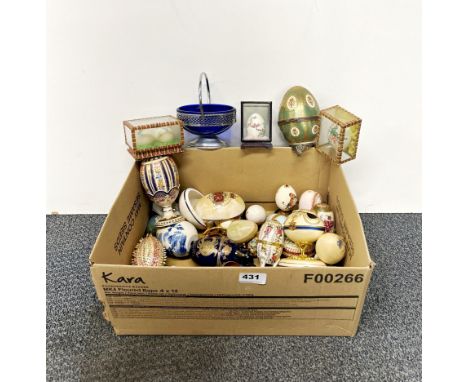 A collection of ceramic and other eggs.