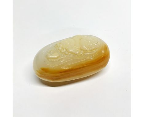 An interesting Chinese banded mutton fat jade / hardstone pebble carved with an image of Putai, H. 8cm.