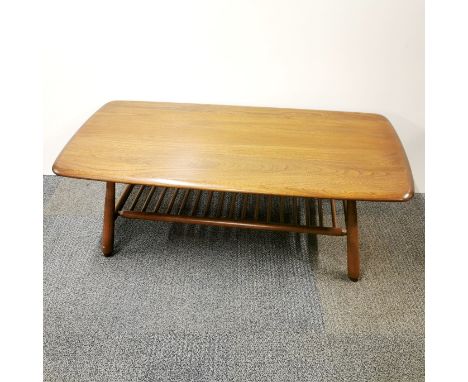 An Ercol elm coffee table with ladder shelf, 105 x 50 x 36cm.
