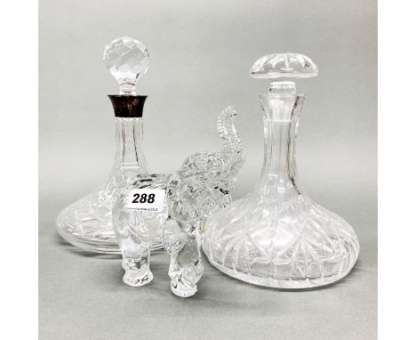 A Waterford crystal elephant, H. 18cm. Together with a silver collar ship's decanter and a further ship's decanter.