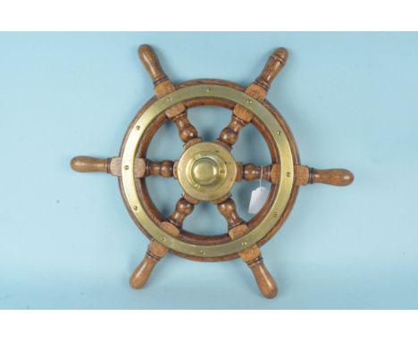 A vintage wood and brass ships wheel, 46cm diameter