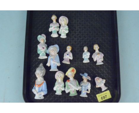 A collection of twelve varying size ceramic half dolls