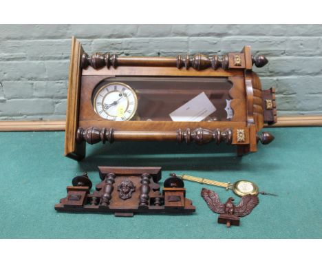 An early 20th Century pine and walnut cased Vienna wall clock