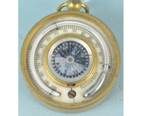 An early 20th Century double sided thermometer and compass and barometer