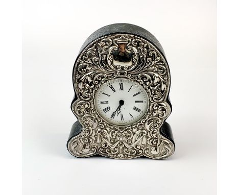 A hallmarked silver and leather covered mantle clock with quartz movement, H. 16cm.