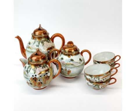 A Japanese hand painted and gilt three-piece tea set with four matching cups without saucers.