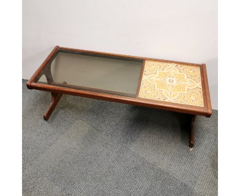 A 1960's teak G Plan style tile and glass topped coffee table, 120 x 50 x 44cm.