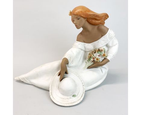 A large Lladro porcelain figure of a young woman with a bouquet of flowers, L. 35cm, H. 26cm. Very slight damage to flower pe