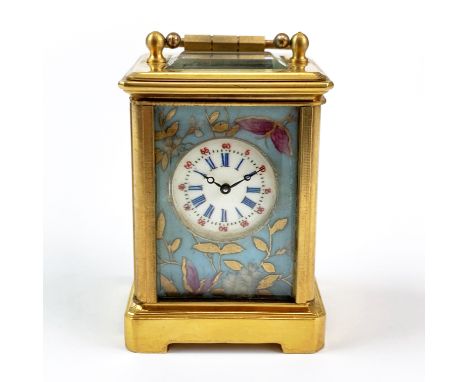 A miniature gilt brass and porcelain carriage clock, H. 7.5cm.