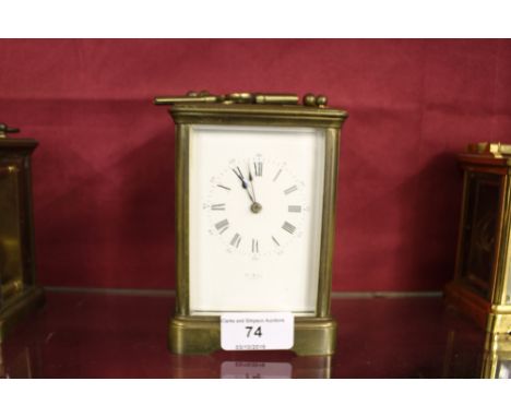 A brass cased carriage clock, the dial signed Henry Mark of Paris