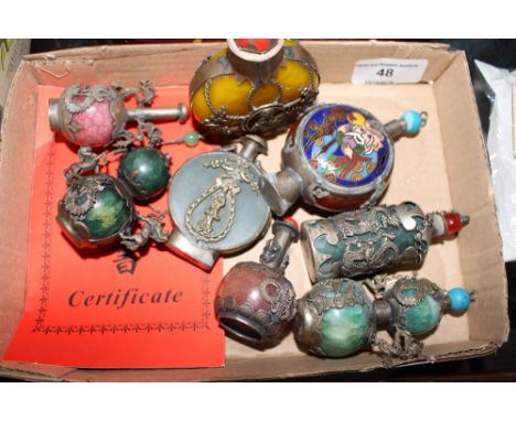 A box containing eight Chinese snuff bottles