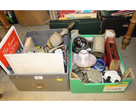 Two boxes containing an onyx table lamp, trinket boxes, ornaments, a glass decanter etc. 