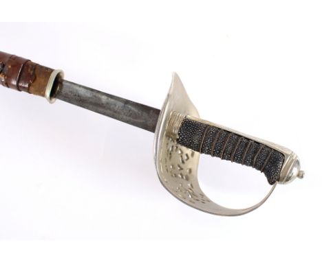 A dress sword with brown leather scabbard