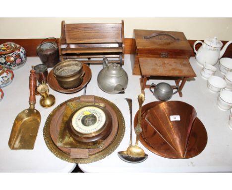 A quantity of wooden and metalware to include book racks; a copper wall pocket; trays; barometer etc.