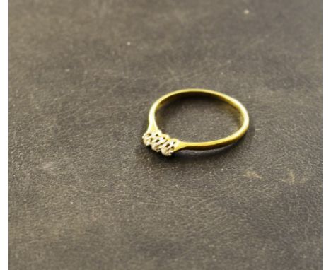 An 18ct gold three stone ring