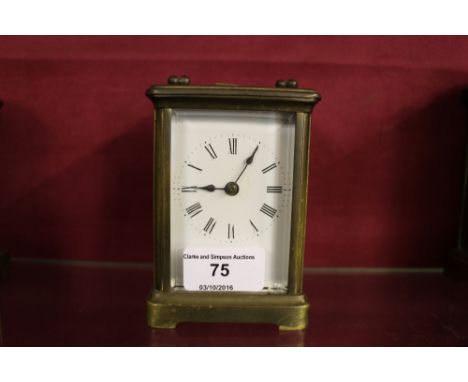 A brass cased carriage clock