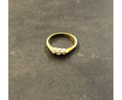 An 18ct gold three stone ring