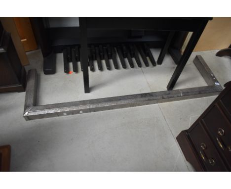 A vintage chrome fire fender in the Art Deco style, rust spots, needs rechroming