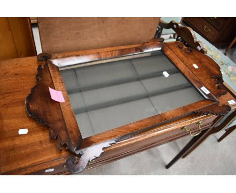 A 19th Century Chippendale revival mirror having mahogany frame