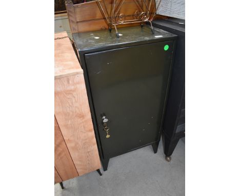 A vintage metal office cabinet , having internal lockable compartments