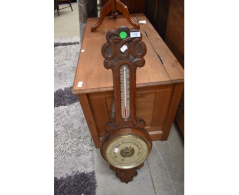 A late 19th or early 20th Century barometer with thermometer scale