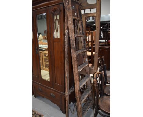 A vintage set of decorators ladders