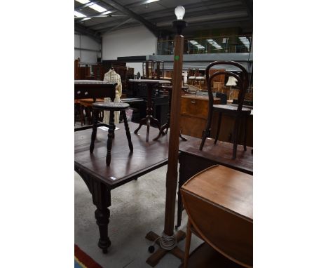 An Arts and Crafts golden oak standard lamp