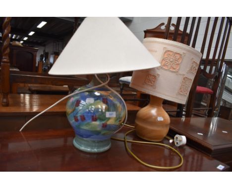 A ceramic table lamp and a turned wood table lamp