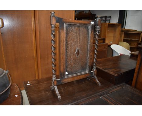 An early 20th Century oak firescreen in the Jacobean style (selling for St Johns Hospice, Lancaster)