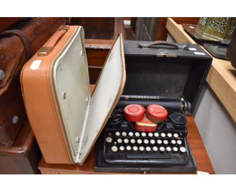 Two vintage typewriters, Olympia and Underwood