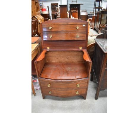 A 19th Century  mahogany bow front commode chest of bow front design , faux drawer fronts with brass handles