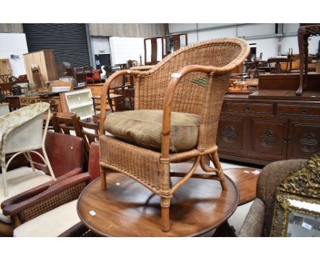 A vintage wicker work tub chair