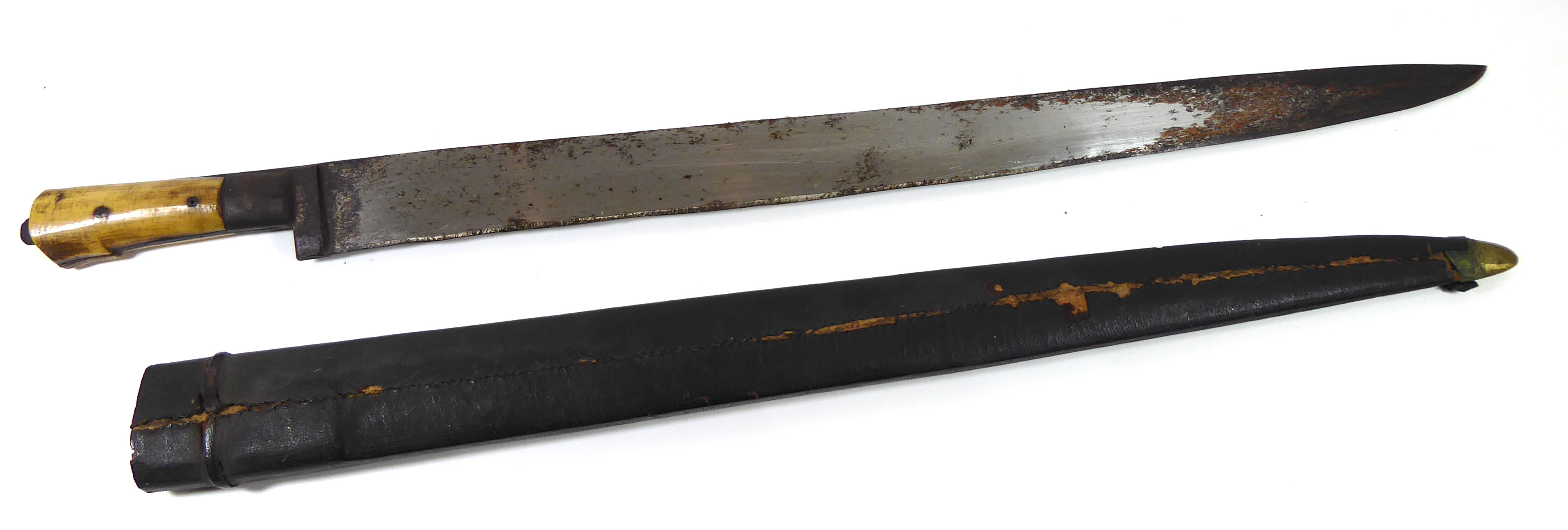 A MIDDLE EASTERN/AFRICAN MACHETE With bone handled grip and leather