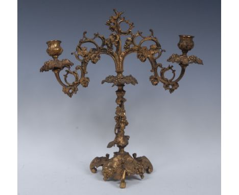 A 19th century Rococo Revival two-light, two-branch candelabrum, acanthus sconces, drip pans, branches, column and tri-form b