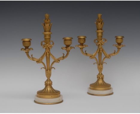 A pair of Louis XVI Revival ormolu two-light candelabra, quiver-capped finials, urnular sconces, acanthus-capped reeded branc