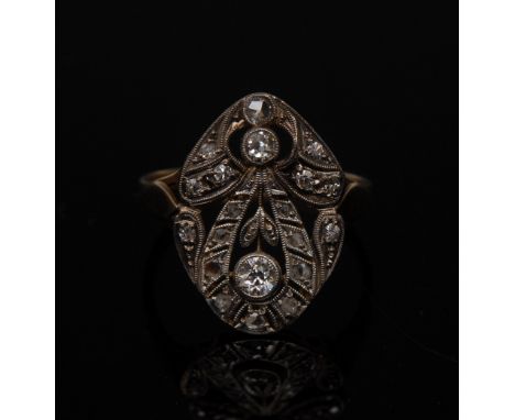 An Art Deco diamond ring, open floral platform inset with twenty round and irregular cut diamonds, total estimated diamond we