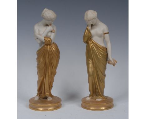 A pair of  Royal Worcester figures, Joy and Sorrow, the classical maidens stands, semi-nude, one with  her face buried in her
