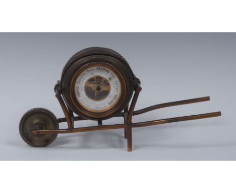 A late Victorian lacquered brass novelty aneroid desk barometer, as a wheel barrow, 5.5cm circular register, 24.5cm long, c.1