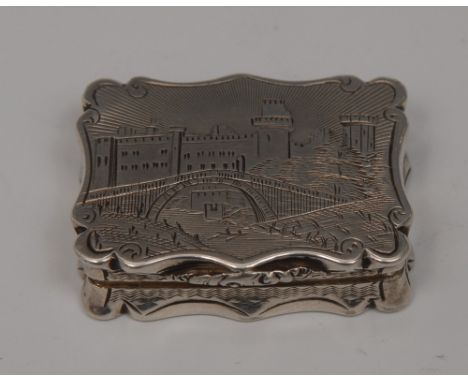 A Victorian silver shaped rectangular castle top vinaigrette, hinged cover brightly engraved with a view of Warwick Castle, w
