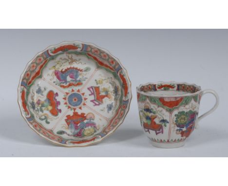 A Worcester Dragon in Compartment pattern fluted coffee cup and saucer,  decorated in colours with alternating panels of drag