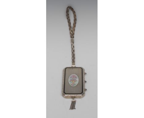 An American sterling silver and enamel canted rectangular lady's evening compact, hinged cover engine turned and decorated in